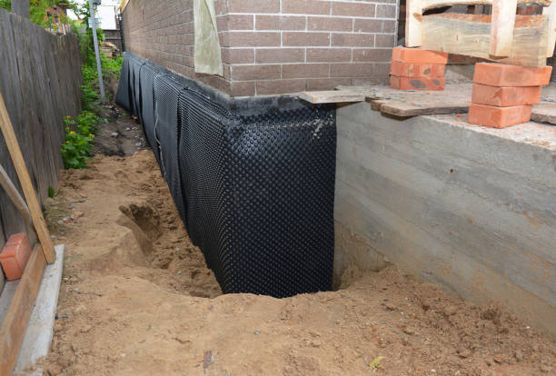 SJ Waterproofing Pros technician performing targeted Exterior Waterproofing assessment in Spring Valley, WI